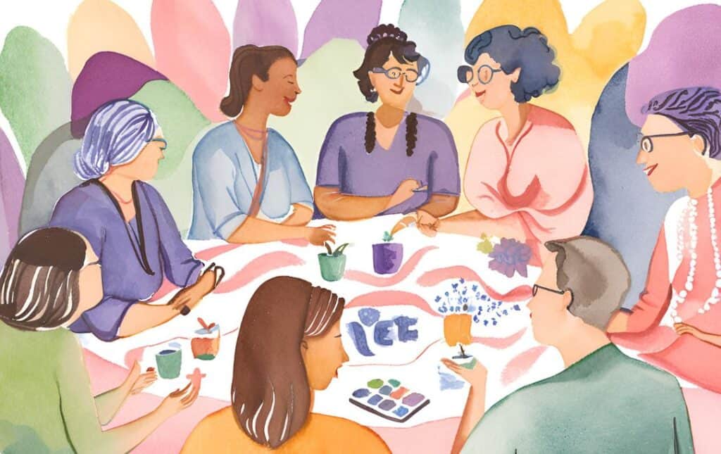 networking event for educators, people sitting and talking around a table, finding your tribe